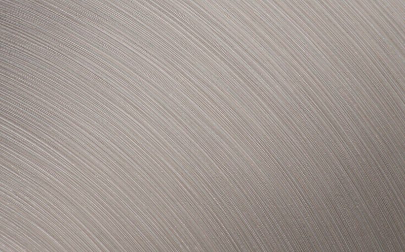 No.4 hairline brushed stainless steel clad plate surface, macro detail of the parallel grain